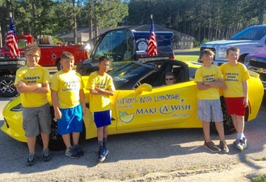 kids take picture with car